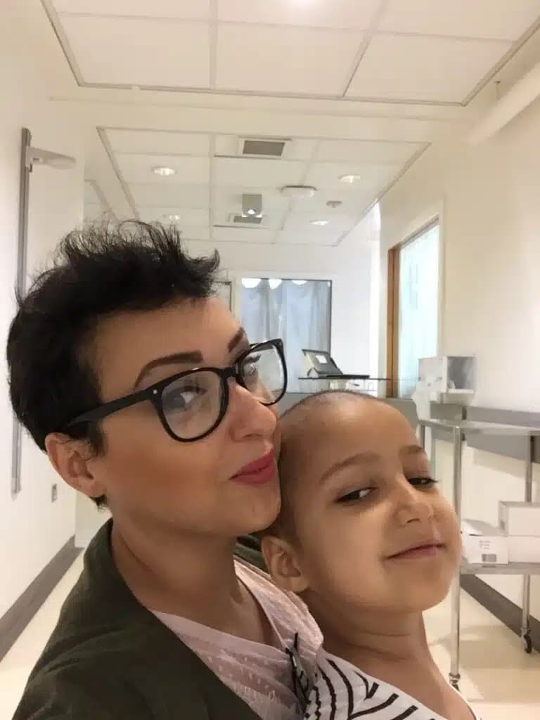 Tia with her mother, Shaima, on a treatment day